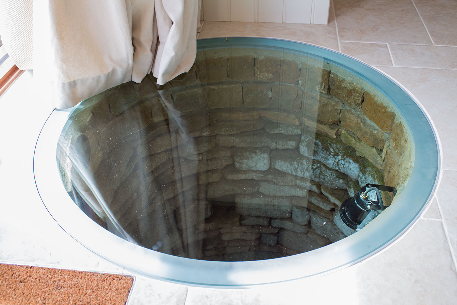 The well topped with glass.